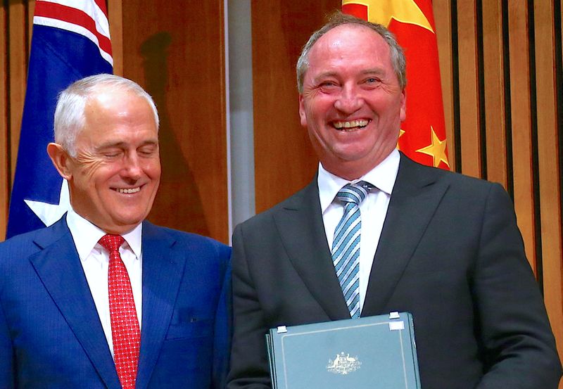 &copy; Reuters. FILE PHOTO: Australia's Prime Minister Malcolm Turnbull stands next to Barnaby Joyce, Australia's Deputy Prime Minister and Minister for Agriculture and Water Resources, during an official signing ceremony at Parliament House in Canberra, Australia March 