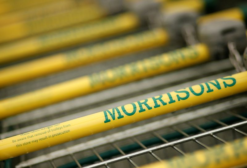 &copy; Reuters. Shopping trolleys stand outside a Morrisons supermarket in Liverpool, northern England, March 12, 2015. REUTERS/Phil Noble/File Photo