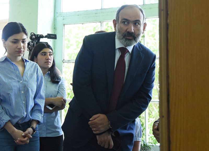 &copy; Reuters. Armenia's acting Prime Minister and leader of Civil Contract party Nikol Pashinyan visits a polling station to cast his vote during the snap parliamentary election in Yerevan, Armenia June 20, 2021. Lusi Sargsyan/Photolure via REUTERS  ATTENTION EDITORS -