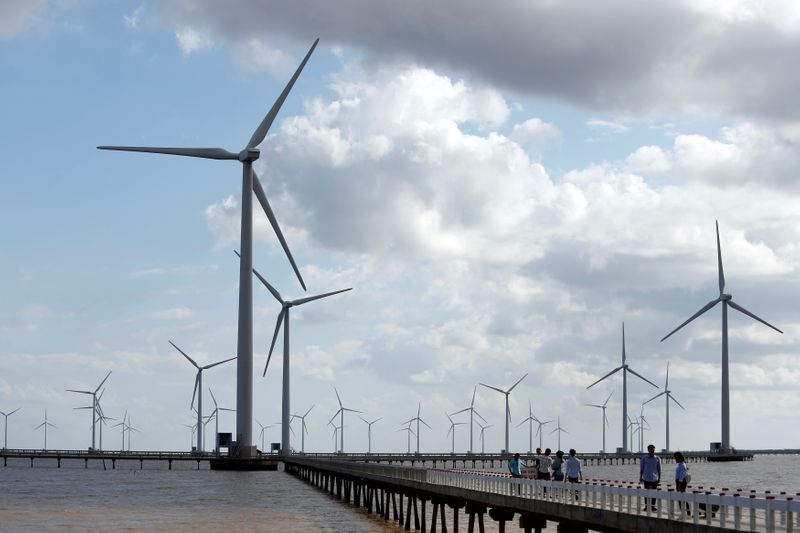 &copy; Reuters. Power-generating windmill turbines are pictured at a wind park in Bac Lieu province, Vietnam, July 8, 2017. REUTERS/Kham