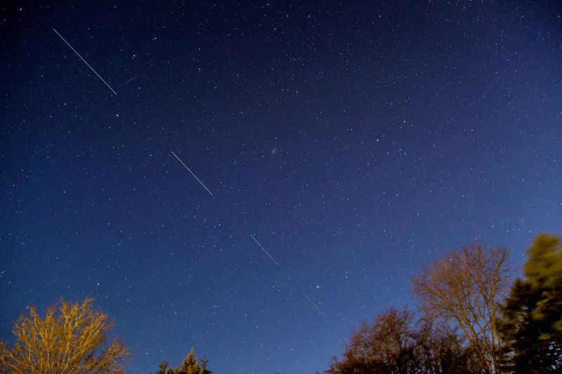 &copy; Reuters. FILE PHOTO: SpaceX Starlink 5 satellites are pictured in the sky seen from Svendborg on South Funen, Denmark April 21, 2020. Picture taken with long exposure. Ritzau Scanpix/Mads Claus Rasmussen via REUTERS