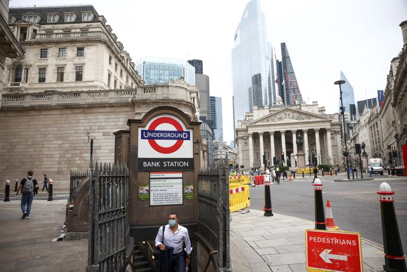 &copy; Reuters. A person exits Bank underground station in the City of London financial district, in London, Britain, June 11, 2021. REUTERS/Henry Nicholls