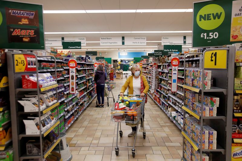 &copy; Reuters. A customer wearing a protective face mask shops at a Morrisons store in St Albans, Britain, September 10, 2020.  REUTERS/Peter Cziborra/File Photo