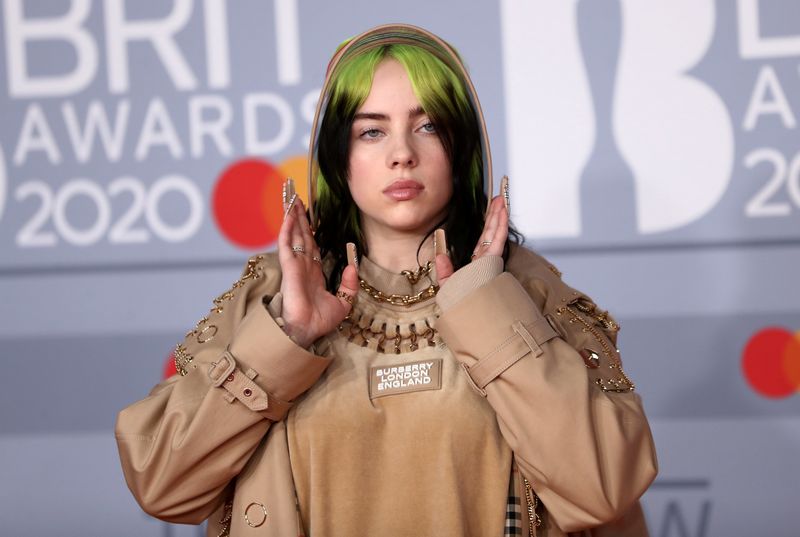 &copy; Reuters. FILE PHOTO: Billie Eilish poses as she arrives for the Brit Awards at the O2 Arena in London, Britain, February 18, 2020 REUTERS/Simon Dawson