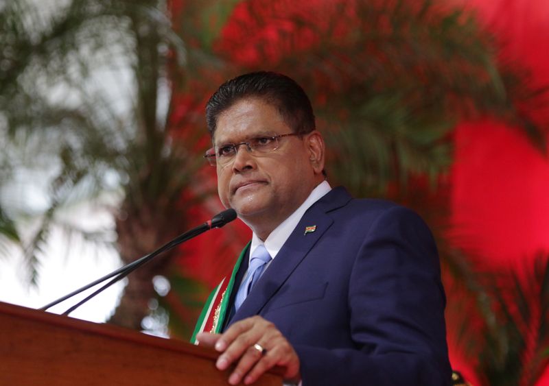 © Reuters. FILE PHOTO: Suriname's new President Chan Santokhi addresses the audience after receiving the presidential sash from outgoing President Desi Bouterse, in Paramaribo, Suriname July 16, 2020.  REUTERS/Ranu Abhelakh