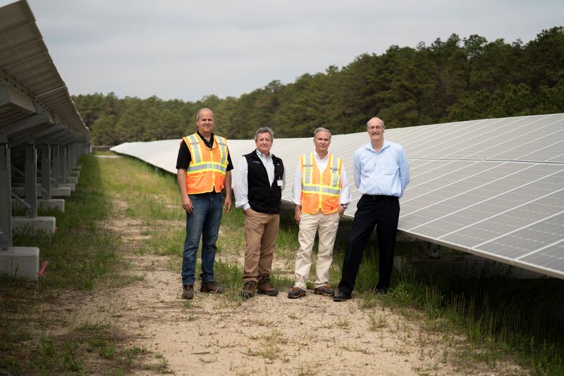 &copy; Reuters. EDF Renewables Director Felix Aguayo, PV One Principal, Elliott Shanley, EDF Renewables Director Thomas Leyden, and BASF Sites Manager Charlie Waltz pose for a photo at the Toms River Solar Farm which was built on an EPA Superfund site in Toms River, New 