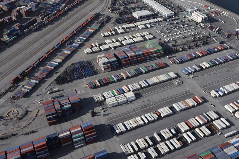 &copy; Reuters. FILE PHOTO: Shipping containers sit on the dock at a container terminal at the Port of Long Beach-Port of Los Angeles complex, amid the coronavirus disease (COVID-19) pandemic, in Los Angeles, California, U.S., April 7, 2021. REUTERS/Lucy Nicholson