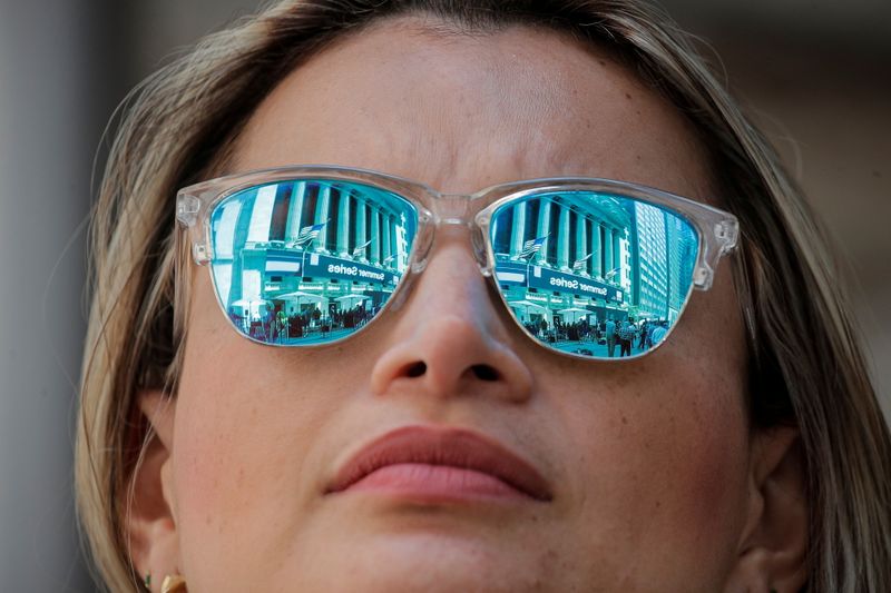 &copy; Reuters. The New York Stock Exchange (NYSE) is reflected in a woman's glasses in New York City, U.S., June 21, 2021.  REUTERS/Brendan McDermid
