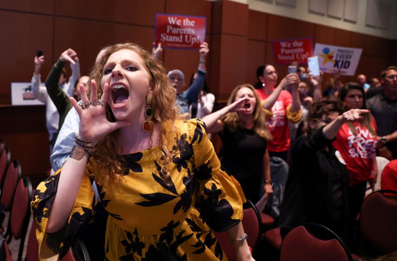 &copy; Reuters. Angry parents and community members protest after a Loudoun County School Board meeting was halted by the school board because the crowd refused to quiet down, in Ashburn, Virginia, U.S.  June 22, 2021. REUTERS/Evelyn Hockstein  