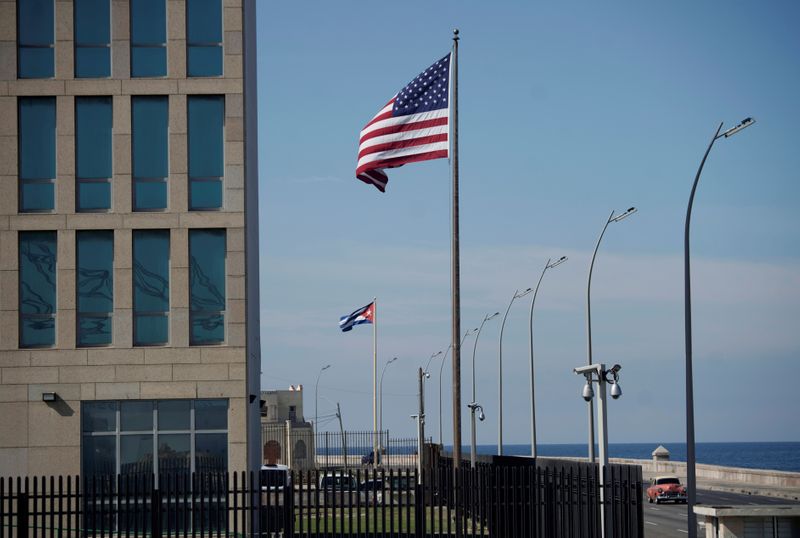 &copy; Reuters. FILE PHOTO: A view of Cuban and U.S. flags beside the U.S. Embassy in Havana, Cuba, December 15, 2020. REUTERS/Alexandre Meneghini/File Photo