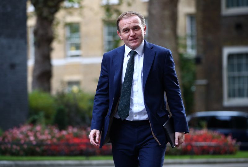&copy; Reuters. FILE PHOTO: Britain's Environment, Food and Rural Affairs Secretary George Eustice walks outside Downing Street in London, Britain, September 30, 2020. REUTERS/Hannah McKay
