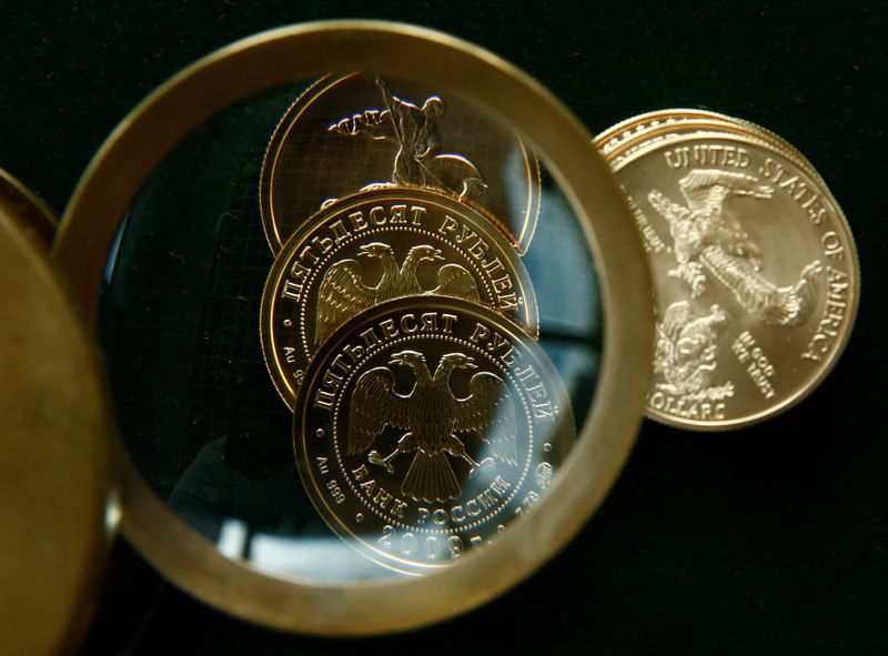 &copy; Reuters. Gold U.S. dollar and Russian rouble bullion coins are seen in this photo illustration taken in Moscow, Russia, August 4, 2017. Picture taken August 4, 2017. REUTERS/Maxim Shemetov/Illustration