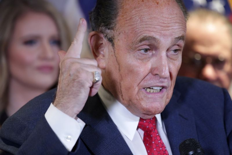 &copy; Reuters. FILE PHOTO: Sweat runs down the face of former New York City Mayor Rudy Giuliani, personal attorney to U.S. President Donald Trump, as he speaks about the 2020 U.S. presidential election results during a news conference at Republican National Committee he