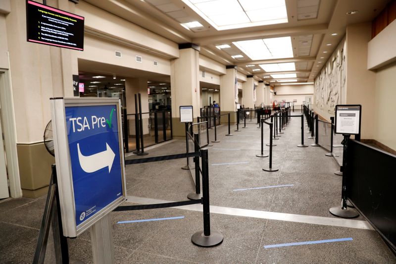 &copy; Reuters. FILE PHOTO: The TSA line at the Daniel K. Inouye International Airport is near empty due to the business downturn caused by the coronavirus disease (COVID-19) in Honolulu, Hawaii, U.S. April 28, 2020. Picture taken April 28, 2020. REUTERS/Marco Garcia