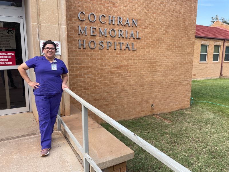 &copy; Reuters. Emily Herrera poses for a photo outside the Cochran Memorial Hospital in Morton, Texas, U.S., June 23, 2021. REUTERS/Brad Brooks