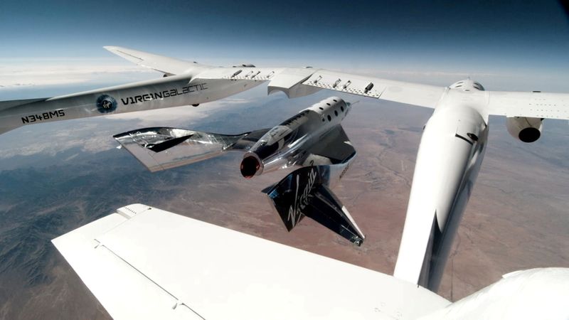 © Reuters. FILE PHOTO: Virgin Galactic's VSS Unity, piloted by CJ Sturckow and Dave Mackay, is released from its mothership, VMS Eve, on the way to its first spaceflight after launch from Spaceport America, New Mexico, U.S. May 22, 2021 in a still image from video.  Virgin Galactic/Handout via REUTERS.  