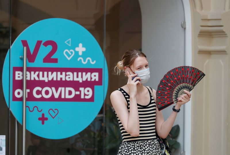 &copy; Reuters. A woman speaks on the phone outside a vaccination centre in the State Department Store, GUM, amid the outbreak of the coronavirus disease (COVID-19), in central Moscow, Russia June 25, 2021. REUTERS/Shamil Zhumatov