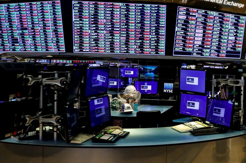 &copy; Reuters. FILE PHOTO: Dividers are seen inside a trading post on the trading floor as preparations are made for the return to trading at the New York Stock Exchange (NYSE) in New York, U.S., May 22, 2020. REUTERS/Brendan McDermid/File Photo