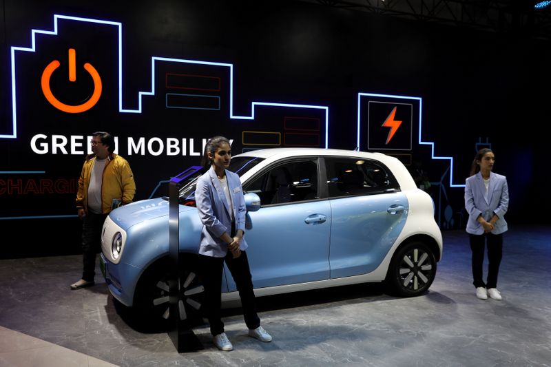 &copy; Reuters. FILE PHOTO: Models pose next to Great Wall Motors (GWM) GWM R1 electric car at its pavilion at the India Auto Expo 2020 in Greater Noida, India, February 5, 2020. REUTERS/Anushree Fadnavis/File Photo