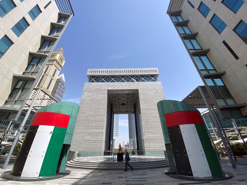 &copy; Reuters. A man walks at the Dubai International Financial Centre, almost empty of people, following the outbreak of coronavirus disease (COVID-19), in Dubai, United Arab Emirates, March 18, 2020. REUTERS/Satish Kumar/Files