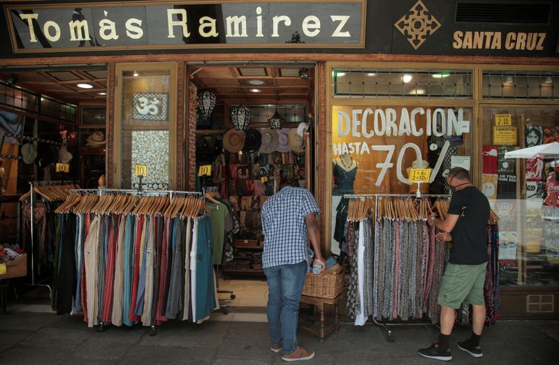 &copy; Reuters. FILE PHOTO: People shop at a store, amid the coronavirus disease (COVID-19) outbreak, in Madrid, Spain, July 31, 2020. REUTERS/Javier Barbancho