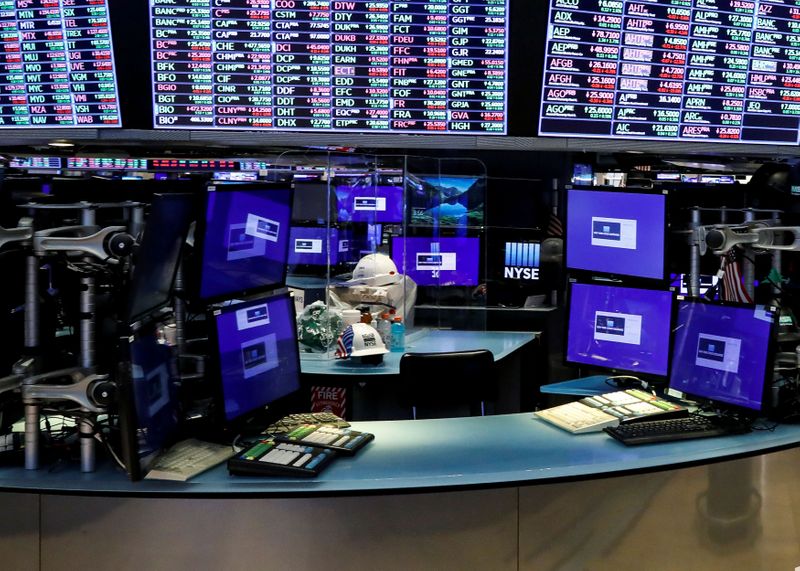 &copy; Reuters. Dividers are seen inside a trading post on the trading floor as preparations are made for the return to trading at the New York Stock Exchange (NYSE) in New York, U.S., May 22, 2020. REUTERS/Brendan McDermid