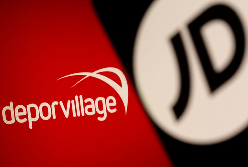 © Reuters. The JD logo is seen on a smartphone in front of a displayed Deporvillage logo in this illustration taken, June 28, 2021. REUTERS/Dado Ruvic/Illustration