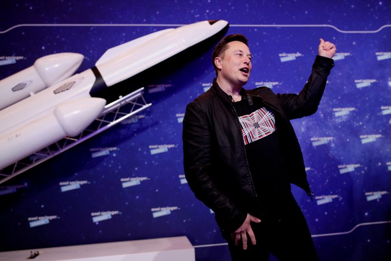 &copy; Reuters. SpaceX owner and Tesla CEO Elon Musk gestures after arriving on the red carpet for the Axel Springer award, in Berlin, Germany, December 1, 2020. REUTERS/Hannibal Hanschke/Pool/File Photo