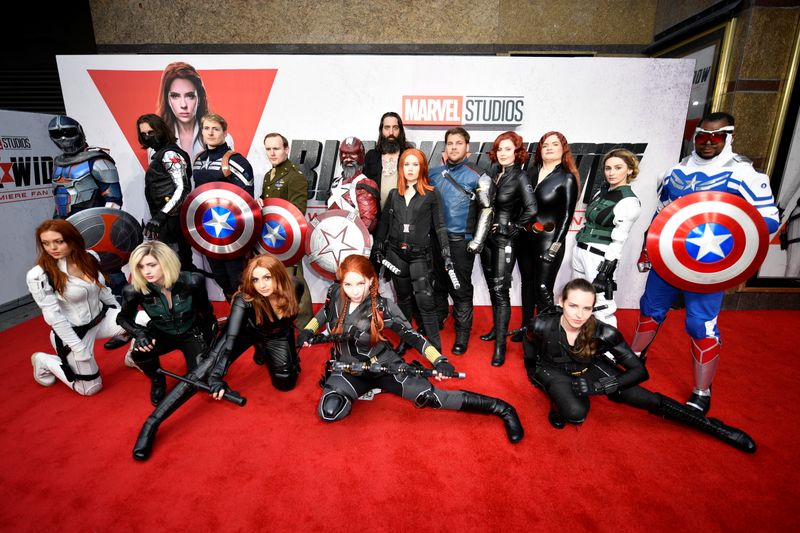 &copy; Reuters. Fans dressed as Avengers characters pose for a picture during a special fan event for the Marvel film "Black Widow" in London, Britain, June 29, 2021. REUTERS/Beresford Hodge