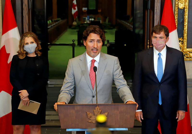 &copy; Reuters. FILE PHOTO: Canadian Prime Minister Justin Trudeau speaks to reporters next to Canadian Deputy Prime Minister and Finance Minister Chrystia Freeland and Minister of Intergovernmental Affairs Dominic LeBlanc on Parliament Hill in Ottawa, Ontario, Canada Au