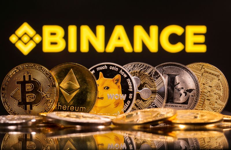 &copy; Reuters. Representations of cryptocurrencies Bitcoin, Ethereum, DogeCoin, Ripple, and Litecoin are seen in front of a displayed Binance logo in this illustration taken, June 28, 2021. REUTERS/Dado Ruvic/File Photo
