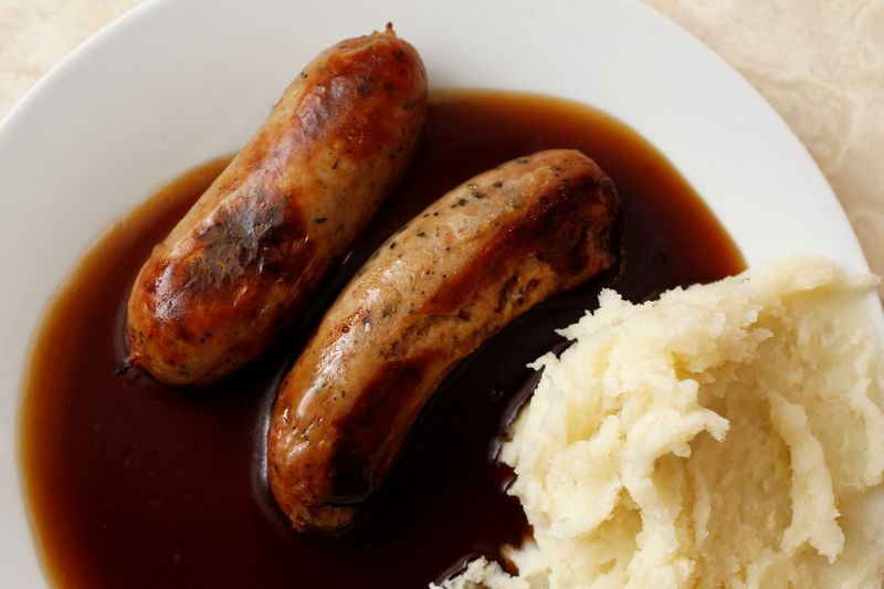 &copy; Reuters. FILE PHOTO: A traditional British meal of sausages and mashed potato in gravy, known as Bangers and Mash, is pictured in G. Kelly's pie and mash shop in east London June 1, 2012. REUTERS/Suzanne Plunkett/File Photo