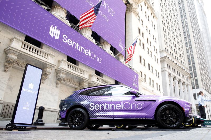 &copy; Reuters. Signage and cars are displayed in honor of SentinelOne, a cybersecurity firm’s IPO, outside the New York Stock Exchange (NYSE) in New York City, U.S., June 30, 2021.  REUTERS/Brendan McDermid