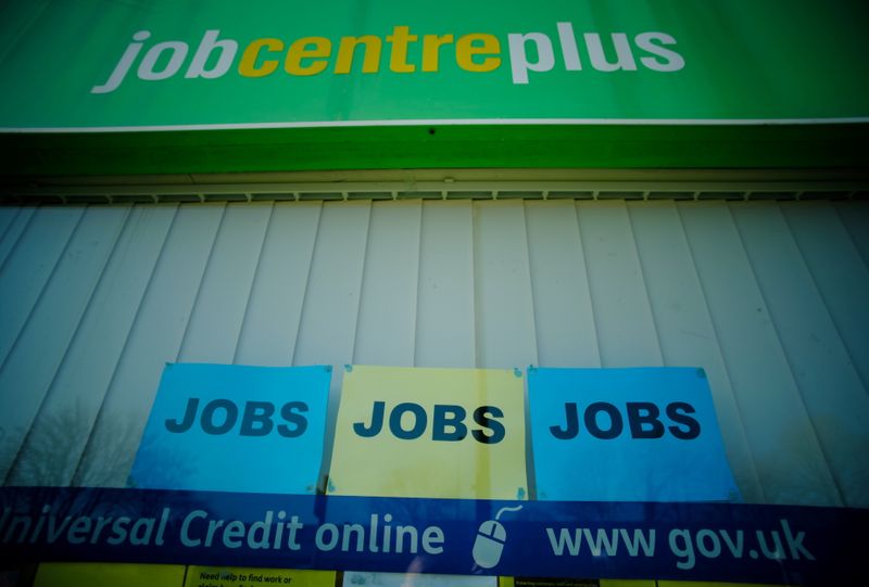 &copy; Reuters. FILE PHOTO: Adverts for jobs are seen in the window of a Jobcentre Plus in Manchester, Britain, March 2, 2021. REUTERS/Phil Noble