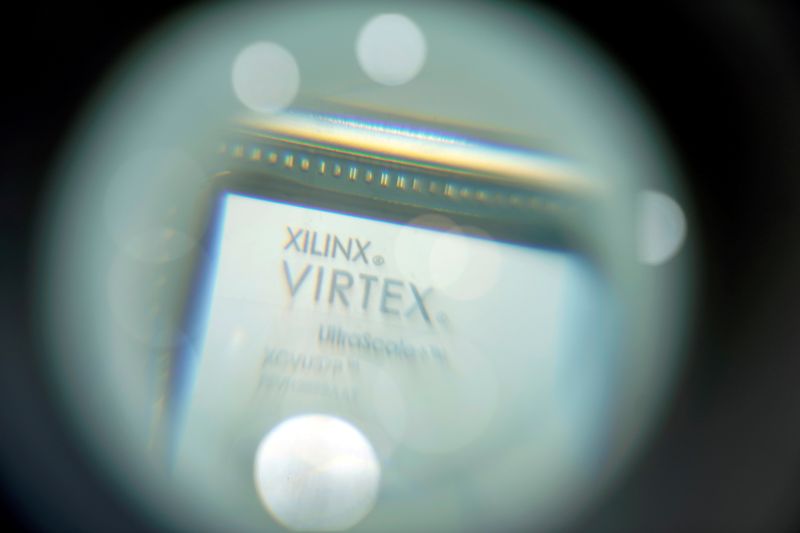 &copy; Reuters. FILE PHOTO: A chip of Xilinx is displayed through a magnifying glass during the China International Import Expo (CIIE), at the National Exhibition and Convention Center in Shanghai, China November 6, 2018. REUTERS/Aly Song/