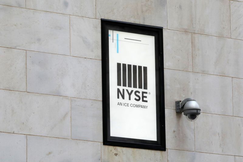 &copy; Reuters. FILE PHOTO: A security camera is seen next to signage outside of the New York Stock Exchange (NYSE) in New York City, New York, U.S., June 28, 2021. REUTERS/Andrew Kelly
