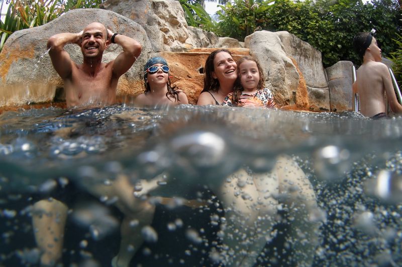 &copy; Reuters. The Kalmar family, tourists from Israel, enjoy in a pool as Phuket reopens to overseas tourists, allowing foreigners fully vaccinated against the coronavirus disease (COVID-19) to visit the resort island without quarantine, in Phuket, Thailand July 2, 202