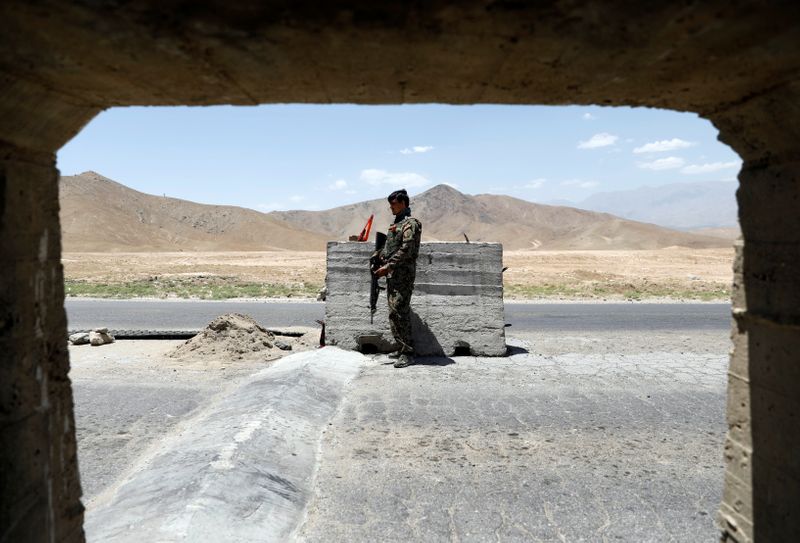&copy; Reuters. FILE PHOTO: An Afghan National Army soldier stands guard at a check post near Bagram U.S. air base, on the day the last of American troops vacated it, Parwan province, Afghanistan July 2, 2021. REUTERS/Mohammad Ismail