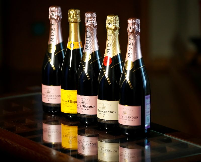 © Reuters. Bottles of Moet & Chandon and Veuve Clicquot French champagne are seen in this illustration picture taken July 5, 2021. REUTERS/Shamil Zhumatov/Illustration