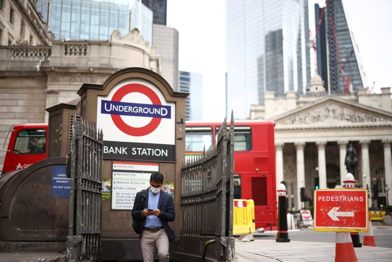 &copy; Reuters. A person exits Bank underground station in the City of London financial district in London, Britain, June 11, 2021. REUTERS/Henry Nicholls/File Photo 