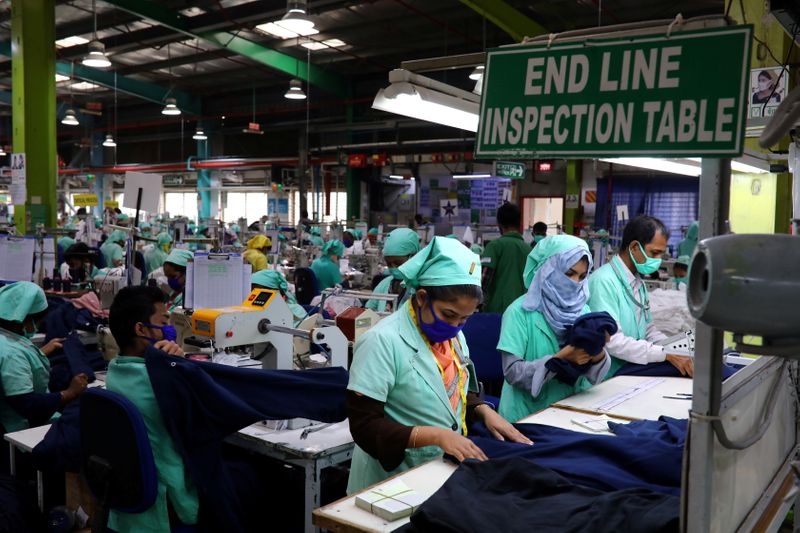 &copy; Reuters. FILE PHOTO: Garment employees work at Fakhruddin Textile Mills Limited in Gazipur, Bangladesh, February 7, 2021. Picture taken February 7, 2021. REUTERS/Mohammad Ponir Hossain