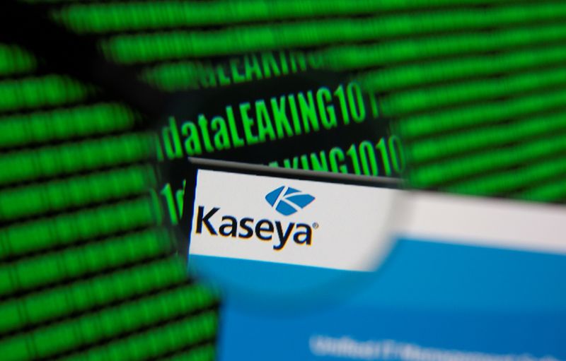 &copy; Reuters. Kaseya's webpage is seen through magnifying glass in front of displayed binary code in this illustration taken, July 6, 2021. REUTERS/Dado Ruvic/Illustration