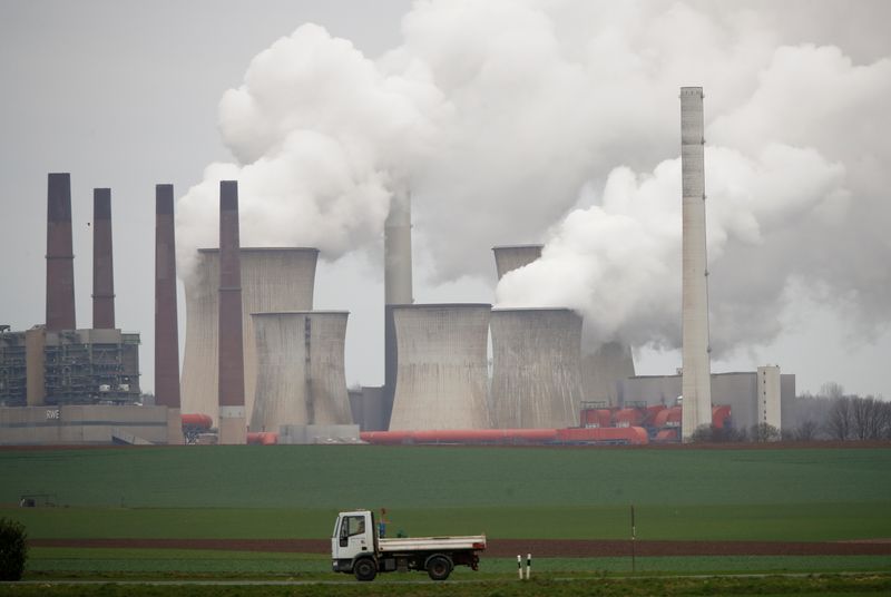 &copy; Reuters. FILE PHOTO: A truck drives by as steam rises from the five brown coal-fired power units of RWE, one of Europe's biggest electricity companies in Neurath, north-west of Cologne, Germany, March 12, 2019. REUTERS/Wolfgang Rattay