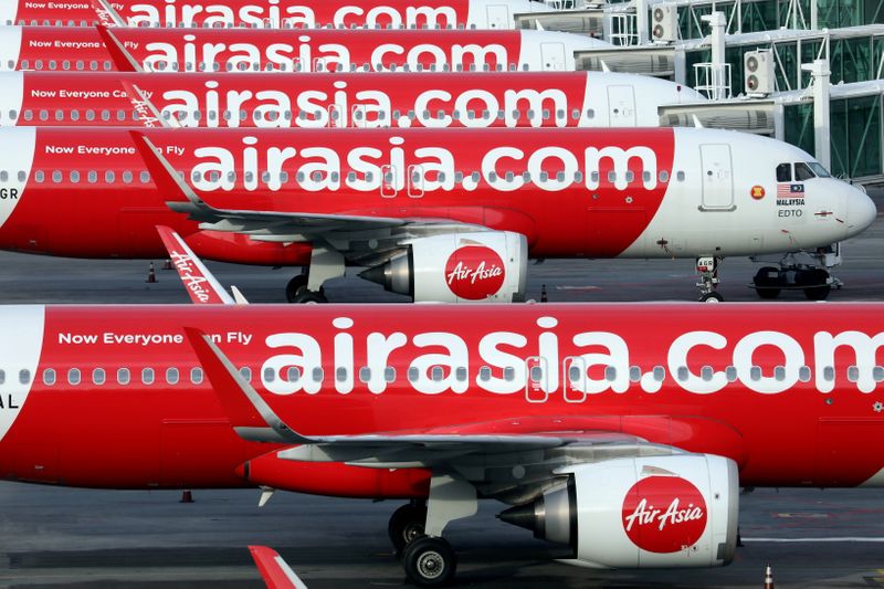 &copy; Reuters. FILE PHOTO: Airasia planes are seen parked at Kuala Lumpur International Airport 2, amid the coronavirus disease (COVID-19) outbreak in Sepang, Malaysia October 6, 2020. REUTERS/Lim Huey Teng/File Photo