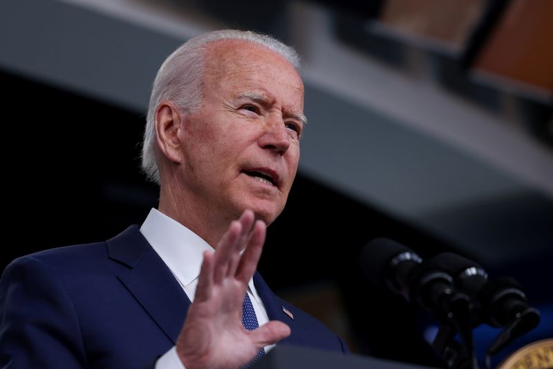 Biden visits Illinois college to push investment as tax battle builds