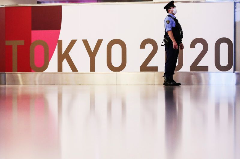 &copy; Reuters. A police officer stands guard before the arrival of International Olympic Committee (IOC) President Thomas Bach at Haneda Airport ahead of Tokyo 2020 Olympic Games, in Tokyo, Japan July 8, 2021. REUTERS/Kim Kyung-Hoon