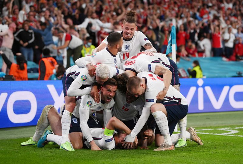 &copy; Reuters. Soccer Football - Euro 2020 - Semi Final - England v Denmark - Wembley Stadium, London, Britain - July 7, 2021 England's Harry Kane celebrates scores their second goal with teammates Pool via REUTERS/Laurence Griffiths     TPX IMAGES OF THE DAY