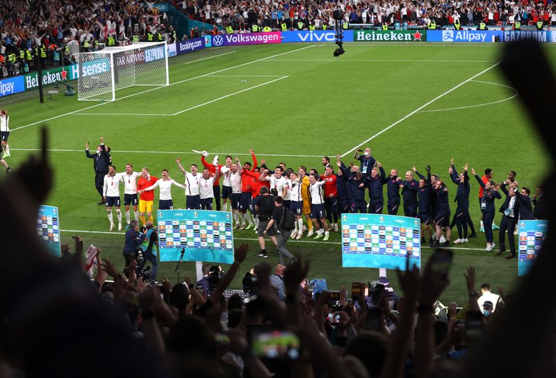 &copy; Reuters. Soccer Football - Euro 2020 - Semi Final - England v Denmark - Wembley Stadium, London, Britain - July 7, 2021 England players celebrate after the match Pool via REUTERS/Catherine Ivill