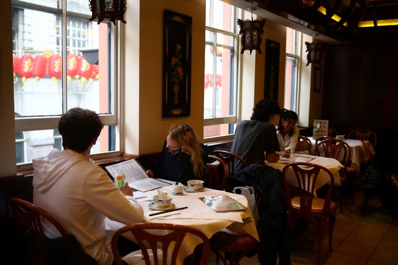 &copy; Reuters. People dine inside a restaurant, amid the outbreak of the coronavirus disease (COVID-19), in Chinatown, London, Britain, 18 May 2021. REUTERS/Hannah McKay/Files