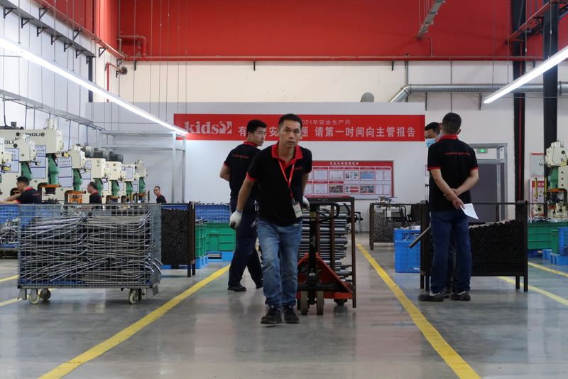 &copy; Reuters. Employees work on the production line of American infant product and toy manufacturer Kids II Inc. at a factory in Jiujiang, Jiangxi province, China June 22, 2021. Picture taken June 22, 2021. REUTERS/Gabriel Crossley